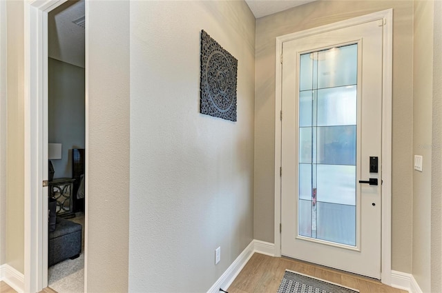 17898 Cherished Loop, Bradenton, FL 34211 - doorway to outside with wood finished floors and baseboards