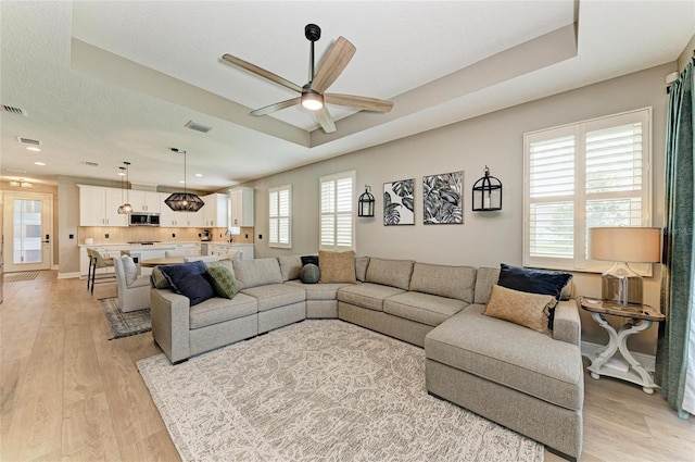 17898 Cherished Loop, Bradenton, FL 34211 - living room with ceiling fan and light wood-style floors