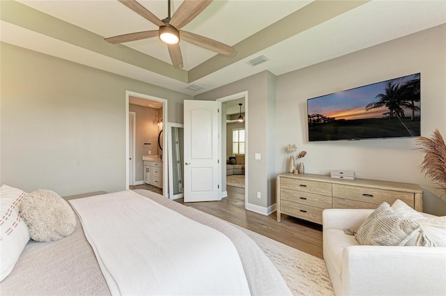 17898 Cherished Loop, Bradenton, FL 34211 - bedroom featuring wood finished floors, baseboards, ensuite bathroom, and a ceiling fan
