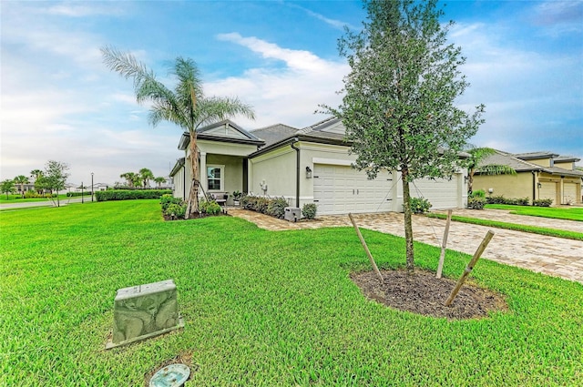 17898 Cherished Loop, Bradenton, FL 34211 - ranch-style house featuring driveway, stucco siding, a front lawn, and an attached garage