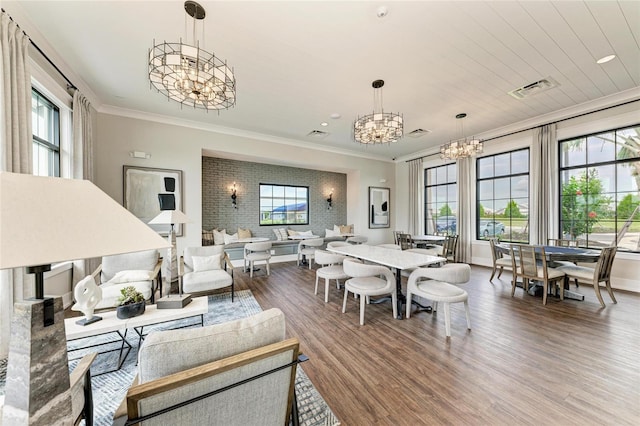 17898 Cherished Loop, Bradenton, FL 34211 - living area featuring a chandelier, wood finished floors, ornamental molding, and baseboards