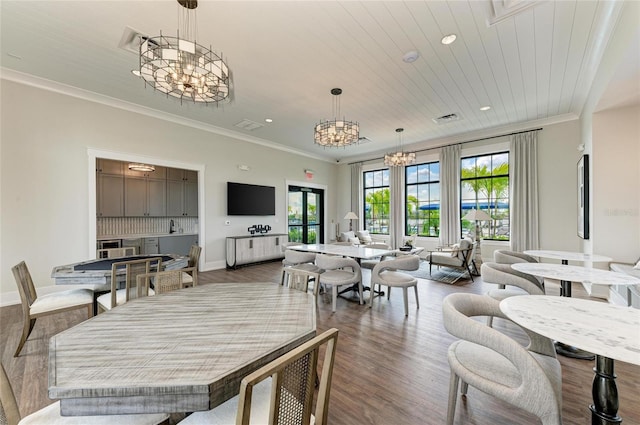 17898 Cherished Loop, Bradenton, FL 34211 - dining space with a chandelier, wood finished floors, crown molding, and recessed lighting