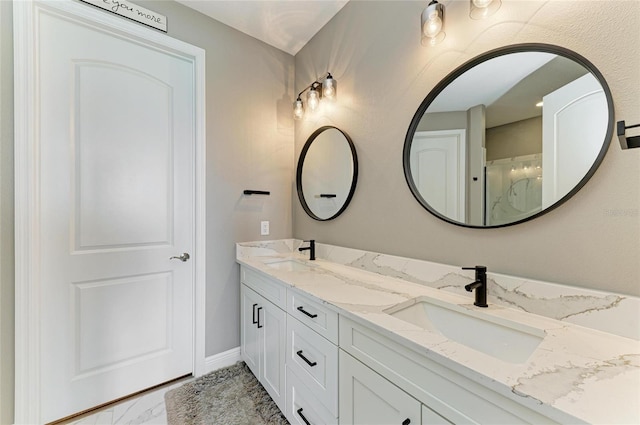 17898 Cherished Loop, Bradenton, FL 34211 - bathroom with marble finish flooring, double vanity, and baseboards