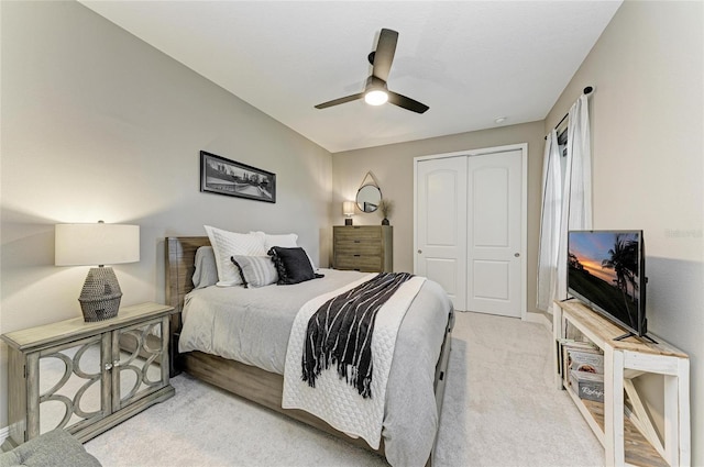 17898 Cherished Loop, Bradenton, FL 34211 - bedroom with a closet, light colored carpet, a ceiling fan, and baseboards