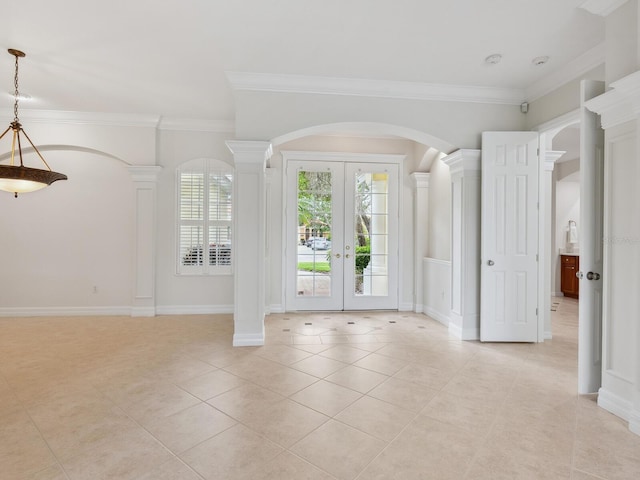 6811 Honeysuckle Trl, Lakewood Ranch, FL 34202 - foyer entrance featuring arched walkways, light tile patterned floors, french doors, ornate columns, and ornamental molding
