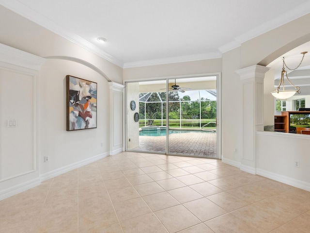 6811 Honeysuckle Trl, Lakewood Ranch, FL 34202 - spare room with light tile patterned floors, ornamental molding, a sunroom, arched walkways, and ceiling fan