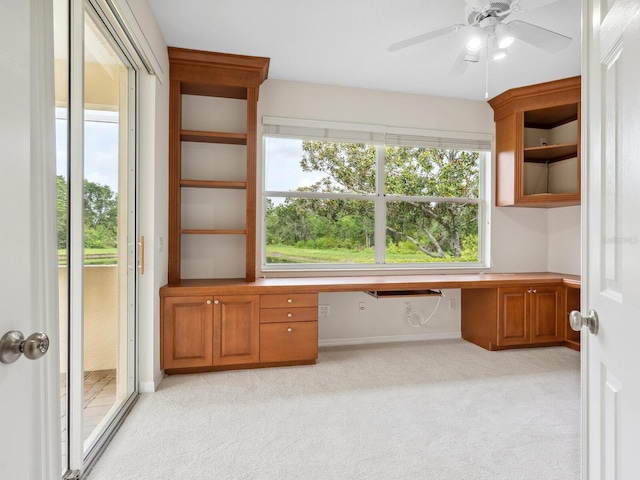 6811 Honeysuckle Trl, Lakewood Ranch, FL 34202 - unfurnished office with built in desk, light carpet, and ceiling fan