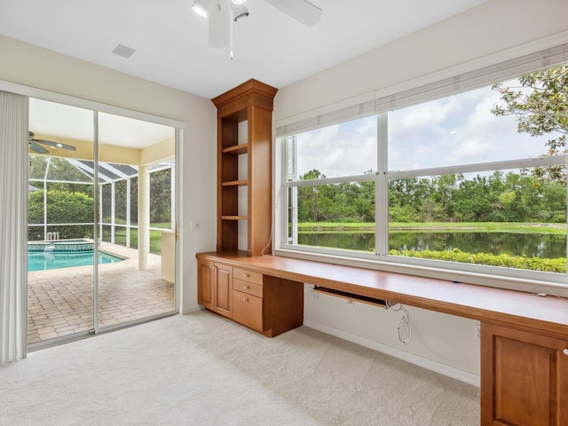 6811 Honeysuckle Trl, Lakewood Ranch, FL 34202 - unfurnished office featuring ceiling fan, a sunroom, light carpet, and built in study area