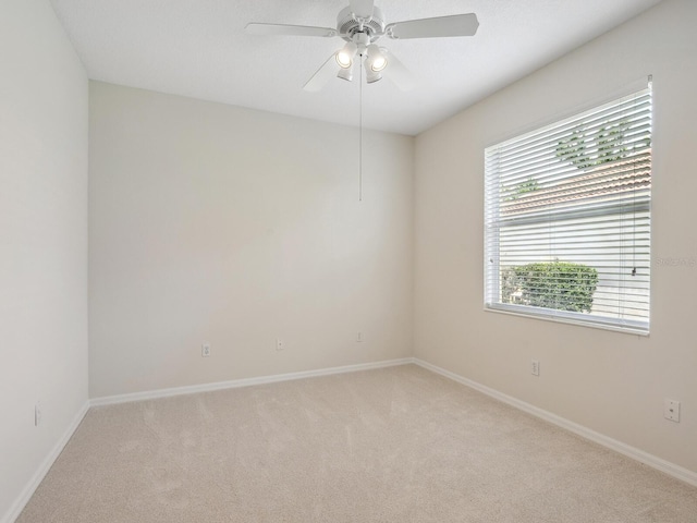 6811 Honeysuckle Trl, Lakewood Ranch, FL 34202 - empty room with light colored carpet and a ceiling fan