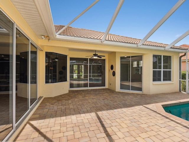 6811 Honeysuckle Trl, Lakewood Ranch, FL 34202 - view of patio / terrace featuring a ceiling fan, glass enclosure, and an outdoor pool