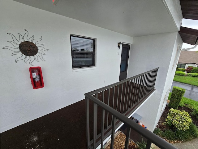1211 Capri Isles Blvd Unit 116, Venice, FL 34292 - exterior view of a fire extinguisher and stucco siding