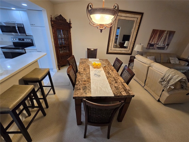 1211 Capri Isles Blvd Unit 116, Venice, FL 34292 - dining space featuring light colored carpet