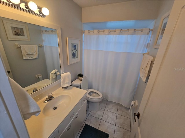1211 Capri Isles Blvd Unit 116, Venice, FL 34292 - bathroom featuring toilet, vanity, a shower with shower curtain, and tile patterned flooring