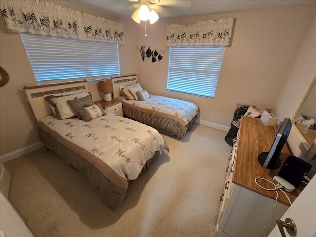 1211 Capri Isles Blvd Unit 116, Venice, FL 34292 - carpeted bedroom with baseboards and ceiling fan