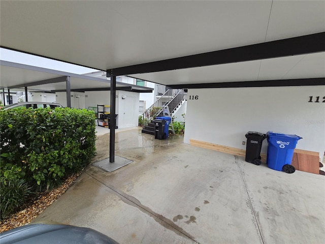 1211 Capri Isles Blvd Unit 116, Venice, FL 34292 - garage featuring baseboards