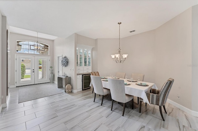 5142 51st Ln W, Bradenton, FL 34210 - dining area with a chandelier, wine cooler, and wood finish floors