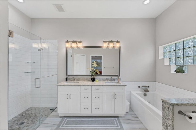 5142 51st Ln W, Bradenton, FL 34210 - bathroom featuring a stall shower, marble look tiles, double vanity, a bath, and recessed lighting