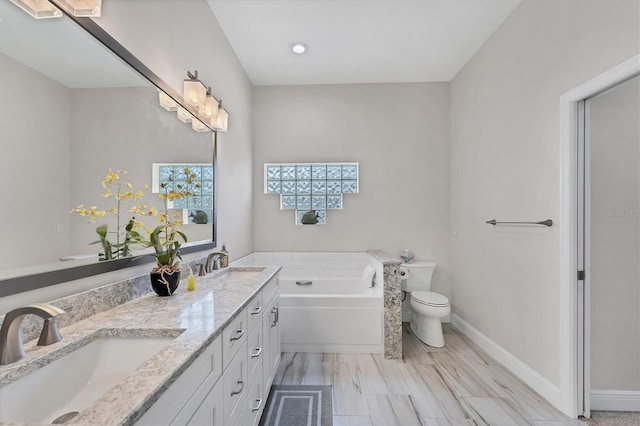 5142 51st Ln W, Bradenton, FL 34210 - bathroom featuring a garden tub, double vanity, and recessed lighting