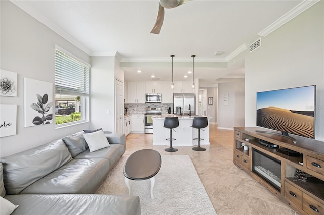 850 Tidewater Shores Loop Unit 108, Bradenton, FL 34208 - living area featuring crown molding, ceiling fan, recessed lighting, and baseboards