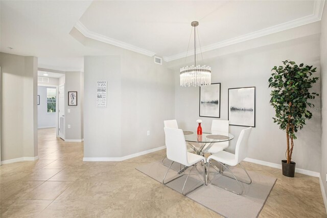 850 Tidewater Shores Loop Unit 108, Bradenton, FL 34208 - dining space with crown molding, light tile patterned floors, a chandelier, and baseboards