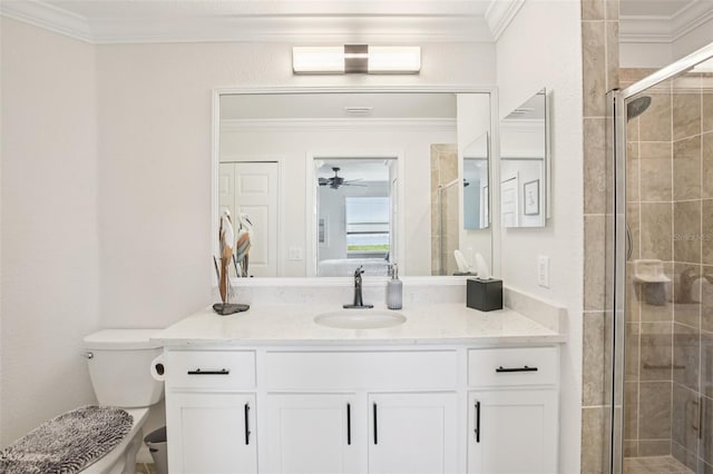 850 Tidewater Shores Loop Unit 108, Bradenton, FL 34208 - full bathroom featuring crown molding, vanity, toilet, a stall shower, and ceiling fan