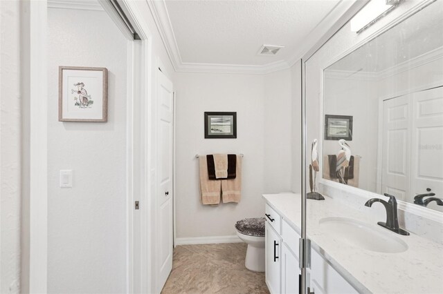 850 Tidewater Shores Loop Unit 108, Bradenton, FL 34208 - bathroom featuring toilet, vanity, crown molding, and baseboards