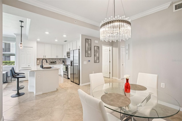 850 Tidewater Shores Loop Unit 108, Bradenton, FL 34208 - dining area with ornamental molding, baseboards, a chandelier, and recessed lighting