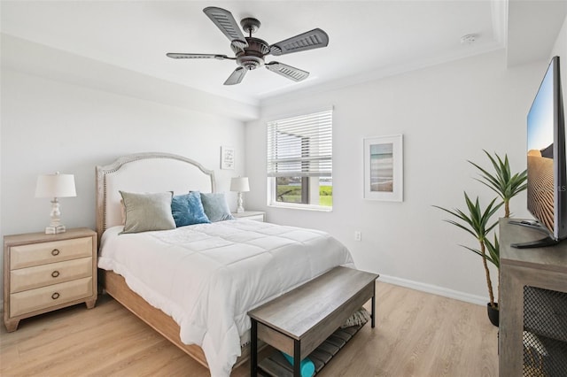 850 Tidewater Shores Loop Unit 108, Bradenton, FL 34208 - bedroom with light wood-style flooring, ceiling fan, and baseboards