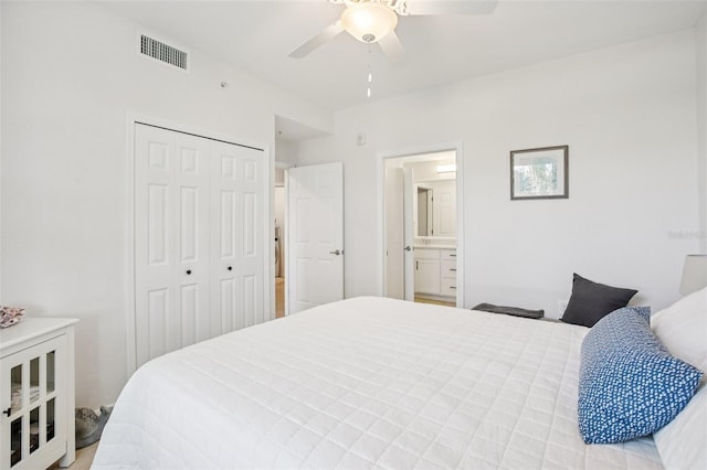 850 Tidewater Shores Loop Unit 108, Bradenton, FL 34208 - bedroom featuring a closet, ceiling fan, and ensuite bath