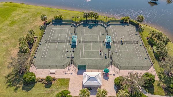 850 Tidewater Shores Loop Unit 108, Bradenton, FL 34208 - aerial view of property and surrounding area featuring a large body of water