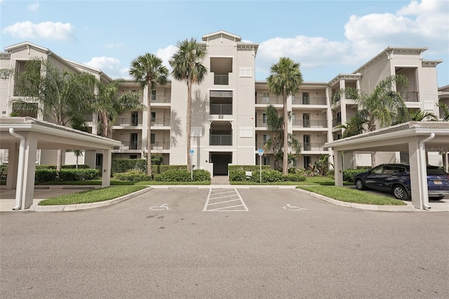 850 Tidewater Shores Loop Unit 108, Bradenton, FL 34208 - view of apartment building / complex featuring covered and uncovered parking