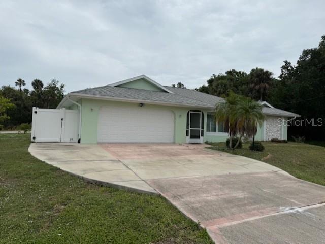 20170 Tralee Dr, Port Charlotte, FL 33952 - ranch-style home featuring an attached garage, concrete driveway, a gate, and a front yard