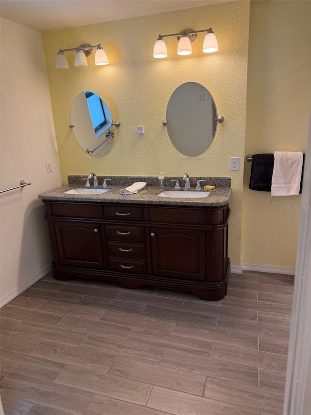 20170 Tralee Dr, Port Charlotte, FL 33952 - full bath featuring double vanity, wood tiled floors, and baseboards