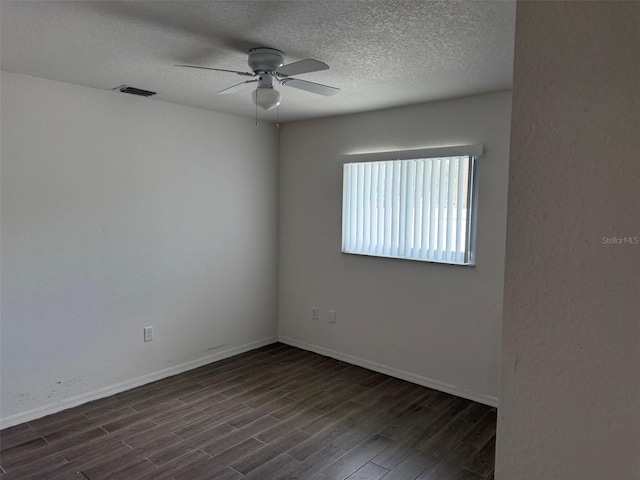 20170 Tralee Dr, Port Charlotte, FL 33952 - spare room featuring a ceiling fan, dark wood-style floors, a textured ceiling, and baseboards