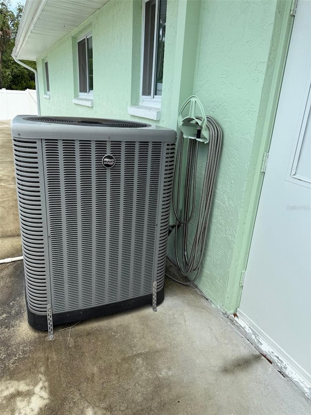 20170 Tralee Dr, Port Charlotte, FL 33952 - exterior view of cooling unit and stucco siding