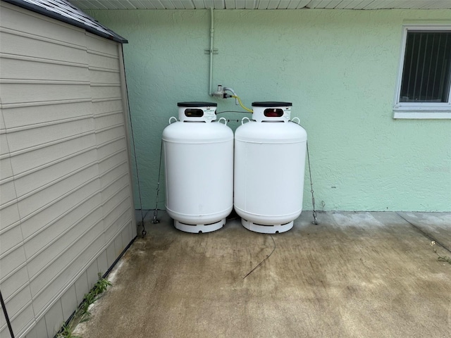 20170 Tralee Dr, Port Charlotte, FL 33952 - exterior view of propane tank and stucco siding