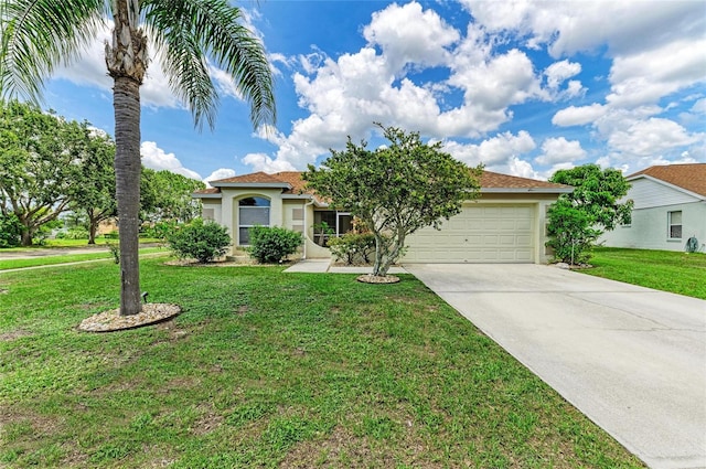 4811 14th Ave E, Bradenton, FL 34208 - view of front of property featuring concrete driveway, a garage, stucco siding, and a front yard