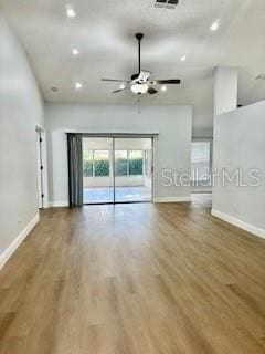 4811 14th Ave E, Bradenton, FL 34208 - unfurnished living room featuring a ceiling fan, wood finished floors, and recessed lighting