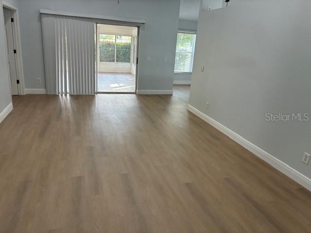 4811 14th Ave E, Bradenton, FL 34208 - spare room featuring baseboards and wood finished floors