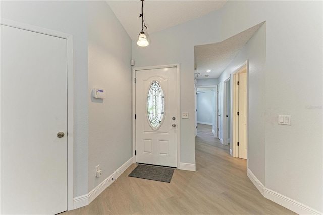4811 14th Ave E, Bradenton, FL 34208 - foyer entrance with light wood-style floors and baseboards