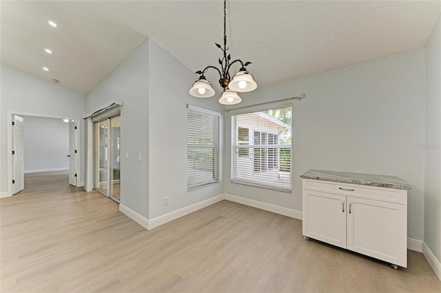 4811 14th Ave E, Bradenton, FL 34208 - unfurnished dining area featuring light wood-style flooring, a chandelier, lofted ceiling, recessed lighting, and a textured ceiling