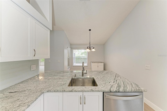 4811 14th Ave E, Bradenton, FL 34208 - kitchen featuring dishwasher, white cabinetry, tasteful backsplash, light stone counters, and vaulted ceiling