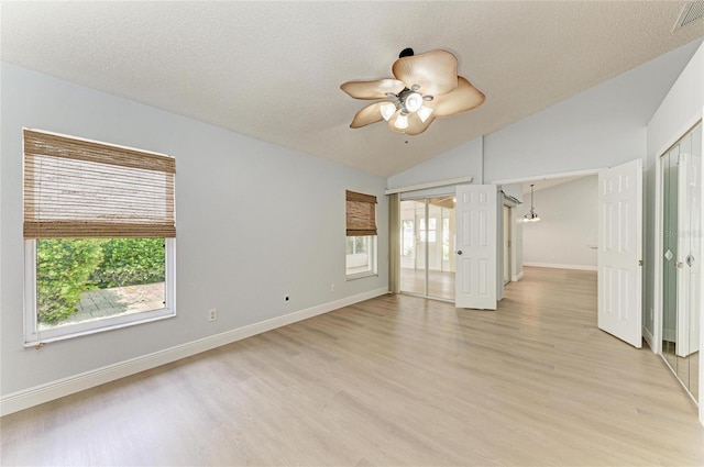 4811 14th Ave E, Bradenton, FL 34208 - unfurnished room with lofted ceiling, light wood-type flooring, ceiling fan, and a textured ceiling