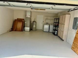 4811 14th Ave E, Bradenton, FL 34208 - garage featuring washing machine and clothes dryer, water heater, and electric panel