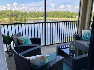 16804 Vardon Ter Unit 307, Bradenton, FL 34211 - balcony with a water view and an outdoor living space