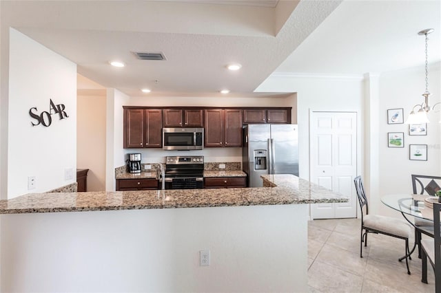 16804 Vardon Ter Unit 307, Bradenton, FL 34211 - kitchen featuring stainless steel appliances, light stone countertops, dark brown cabinetry, ornamental molding, and a peninsula