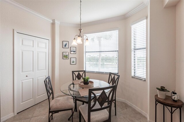 16804 Vardon Ter Unit 307, Bradenton, FL 34211 - dining room with a chandelier, ornamental molding, plenty of natural light, baseboards, and light tile patterned flooring