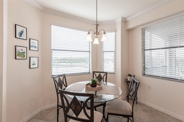 16804 Vardon Ter Unit 307, Bradenton, FL 34211 - dining area featuring a chandelier, plenty of natural light, ornamental molding, baseboards, and light tile patterned floors