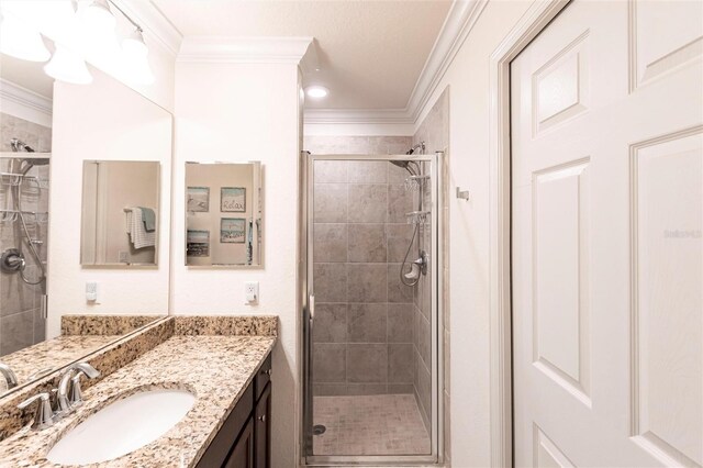 16804 Vardon Ter Unit 307, Bradenton, FL 34211 - bathroom with crown molding, a stall shower, and vanity