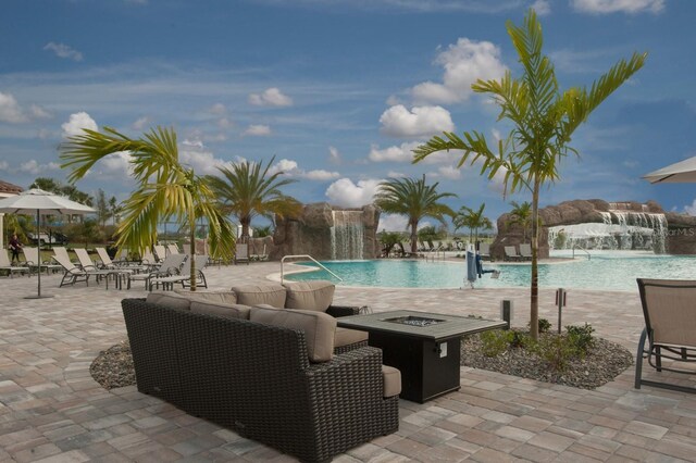 16804 Vardon Ter Unit 307, Bradenton, FL 34211 - community pool featuring an outdoor fire pit and a patio